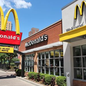 CHICAGO, USA - JUNE 28, 2013: People walk by McDonald's restaurant in Chicago. McDonald's is the 2nd most successful restaurant franchise in the world with 33,000 locations.