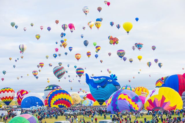 Balloons fly over Albuquerque on October 11, 2014 in Albuquerque, New Mexico. Albuquerque balloon fiesta is the biggest balloon event in the world.