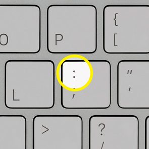 Key with colon and semicolon symbols highlighted, surrounded by other keyboard keys.