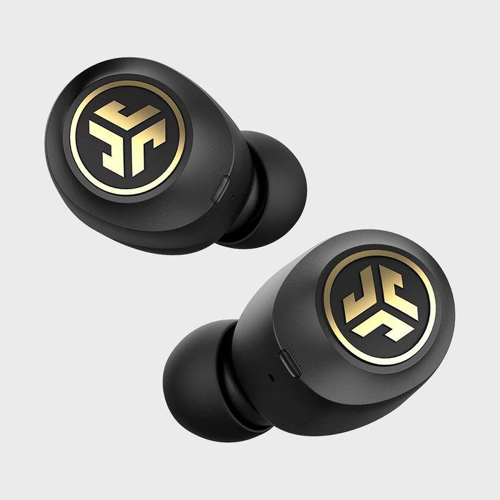 Earbuds display a logo and sit against a light gray background, showing a sleek, modern design with gold and black accents.