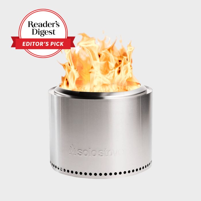 A stainless steel fire pit with flames, labeled 