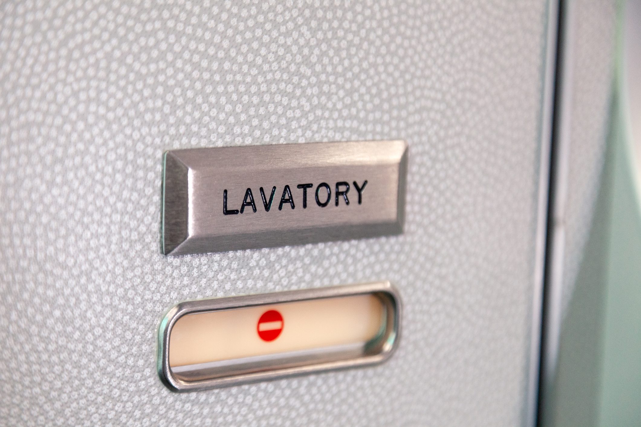 bathroom sign on an airplane