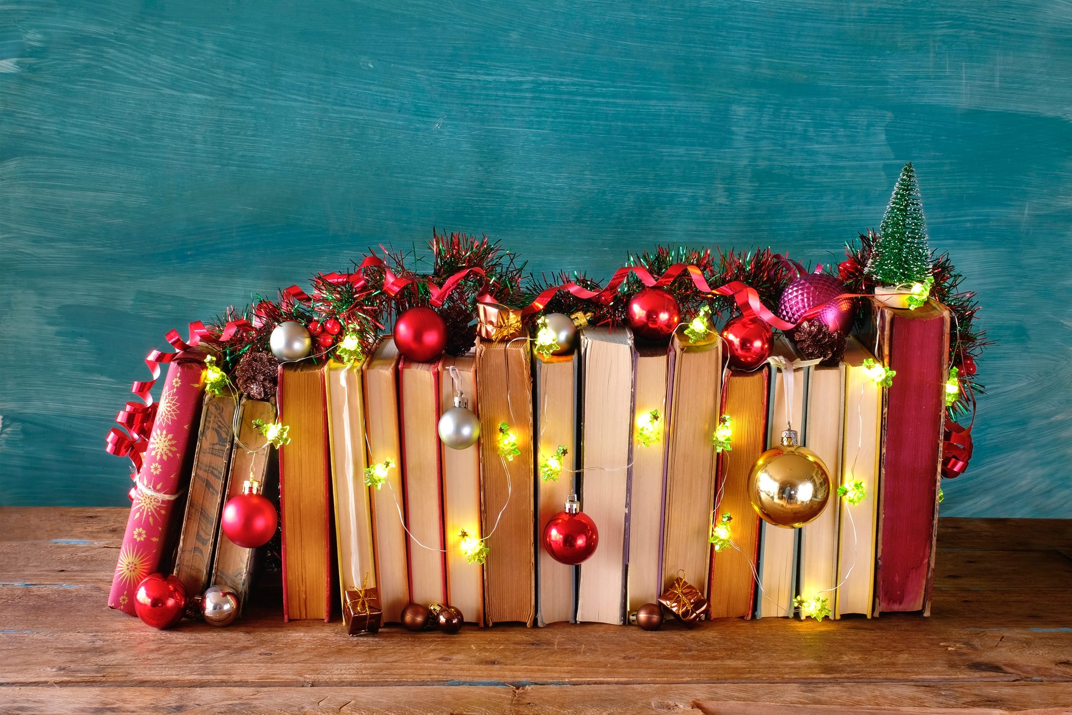 giving books for christmas,books as christmas gift,christmas present,reading,literature,education,making a gift concept, copy space