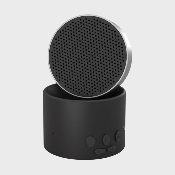 Speaker swivels on base, featuring control buttons, against a plain gray background.