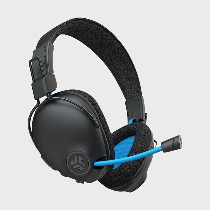 Headset featuring a black and blue design with a microphone, resting against a plain light gray background.