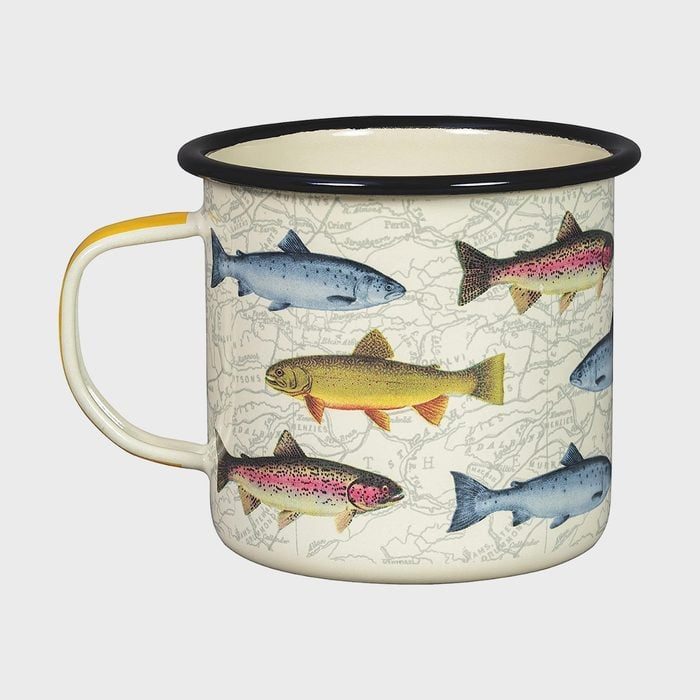 A mug displays colorful fish illustrations on a map-printed background, with a black rimmed top and yellow-accented handle.