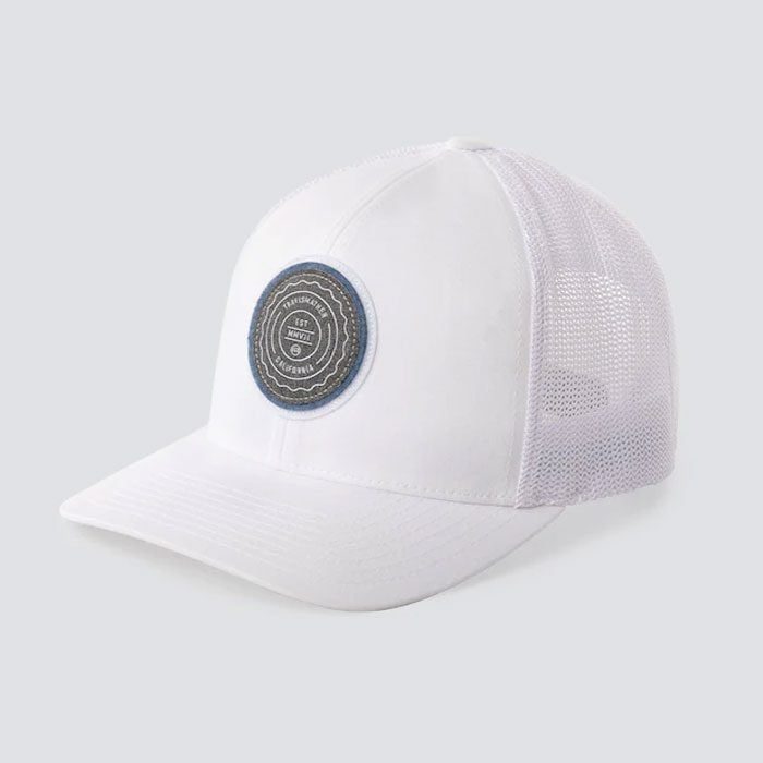 White trucker cap with mesh back, featuring circular patch with text 