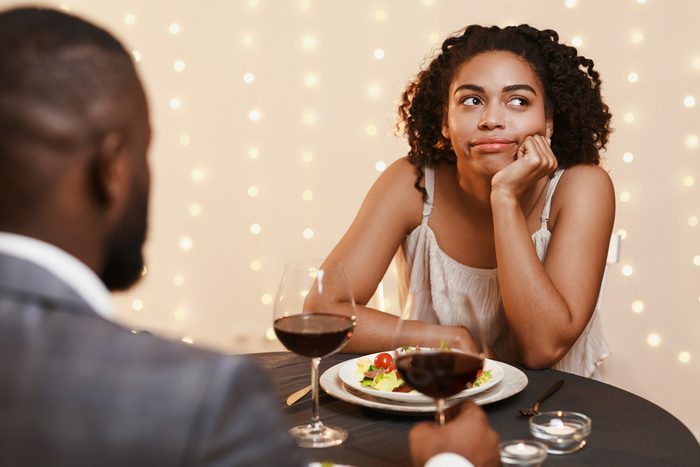 woman bored at dinner