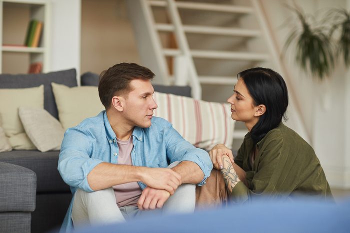 couple having a conversation in their home