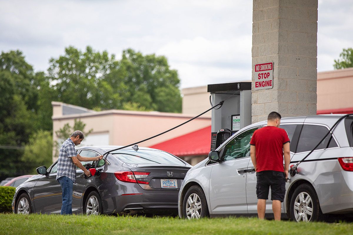 Customer filling up gas in their car at costco gasoline