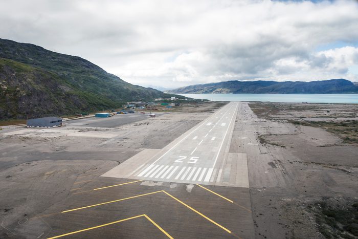 Airport in Narsarsuaq Greenland. Empty airstrip in fjord.