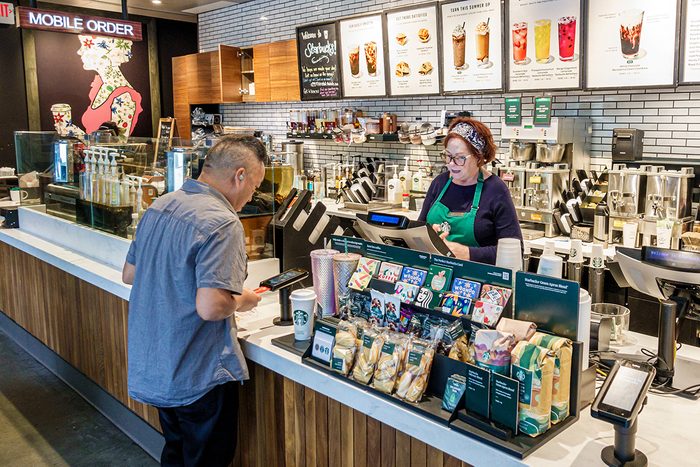 Starbucks Coffee, barista taking order, credit card scanner