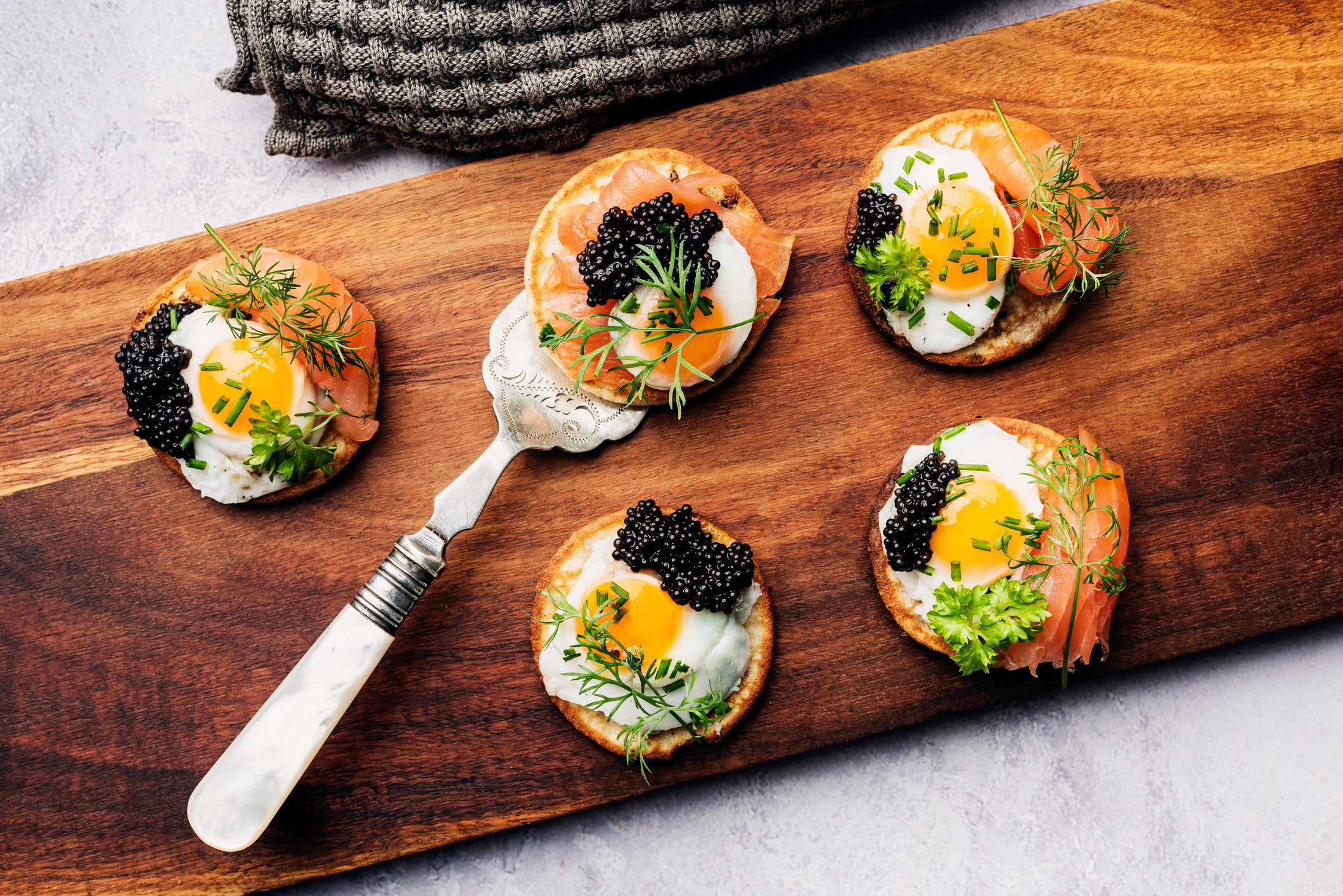 Blinis With Quail Eggs Smoked Salmon and Caviar