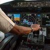 Modern commercial jet aircraft cockpit and pilots