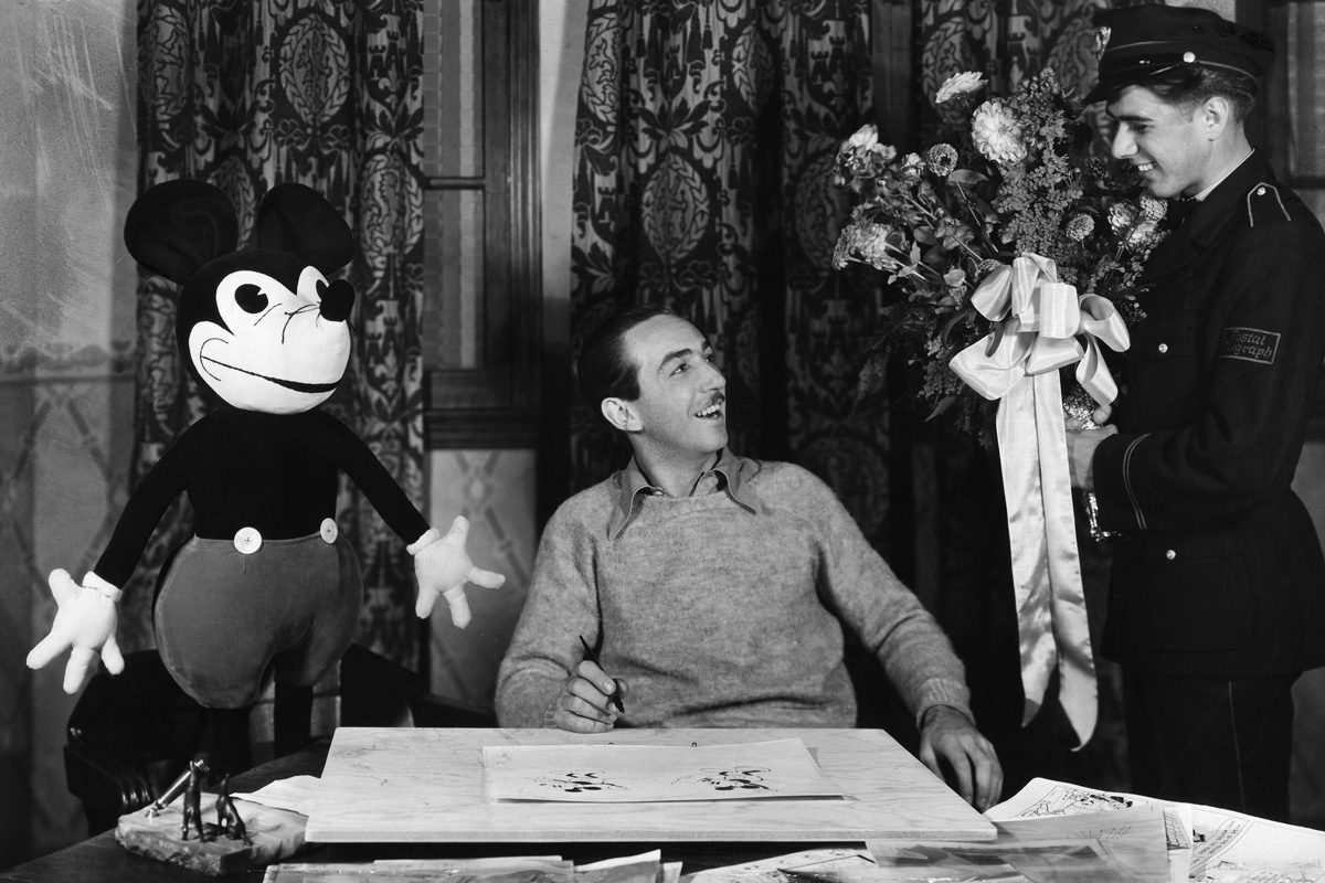 Walt Disney next to Mickey mouse